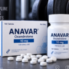 Anavar Oxandrolone bottle and box with white tablets on a dark background